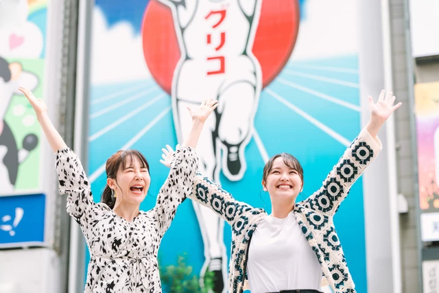 Women posing in Dotonbori